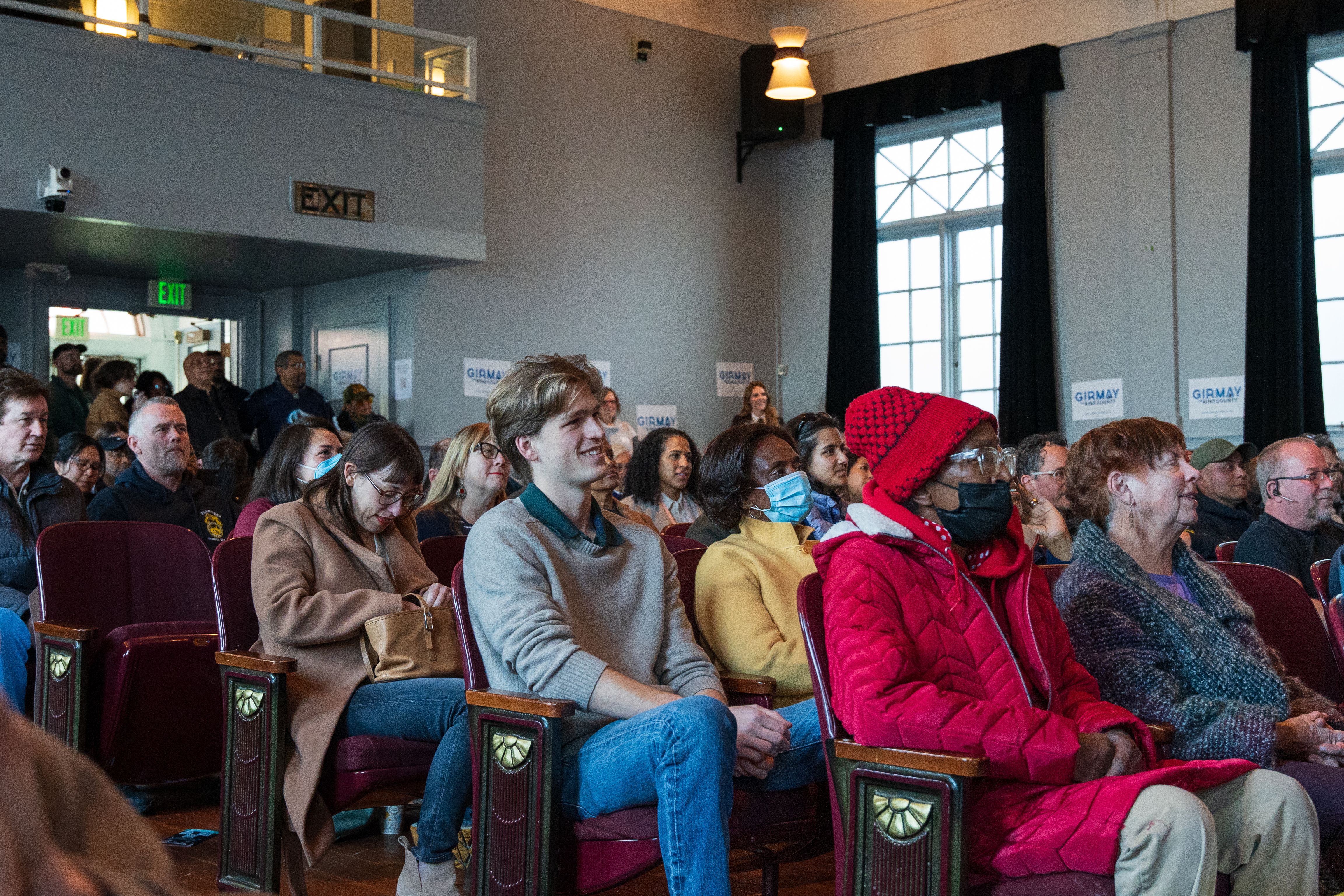 A diverse group of people attending a community meeting in Seattle, Washington