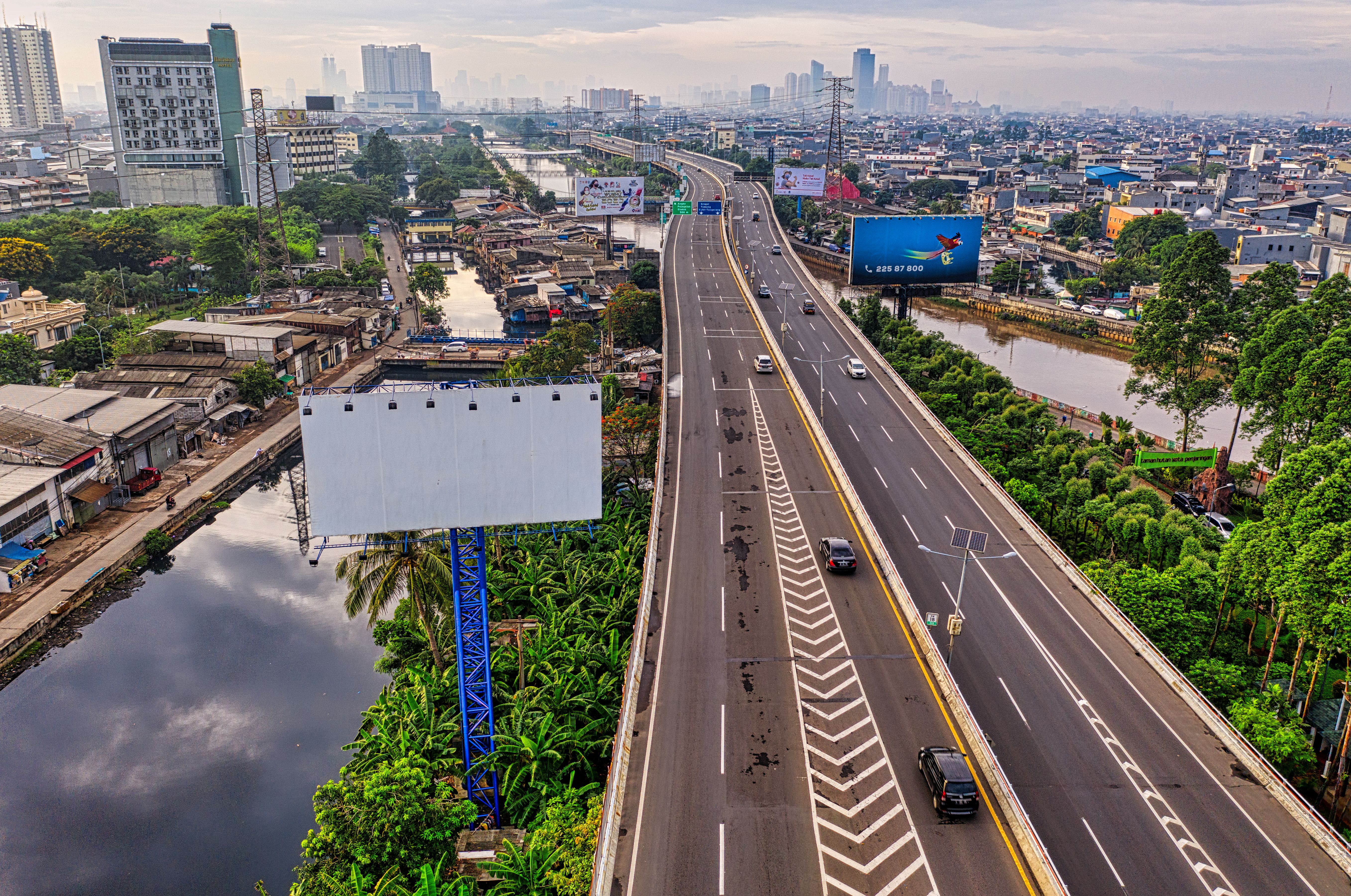 Aerial view of an expressway in Jakarta, illustrating regional transport infrastructure and metropolitan expansion.